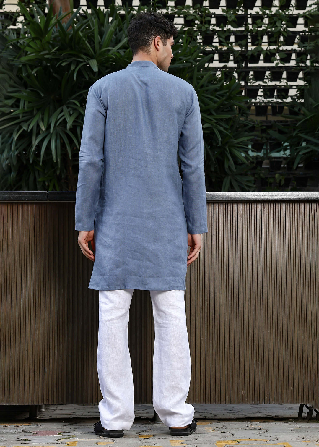 Man wearing Blue Grey Kurta, 100% pure linen, outdoor green background.