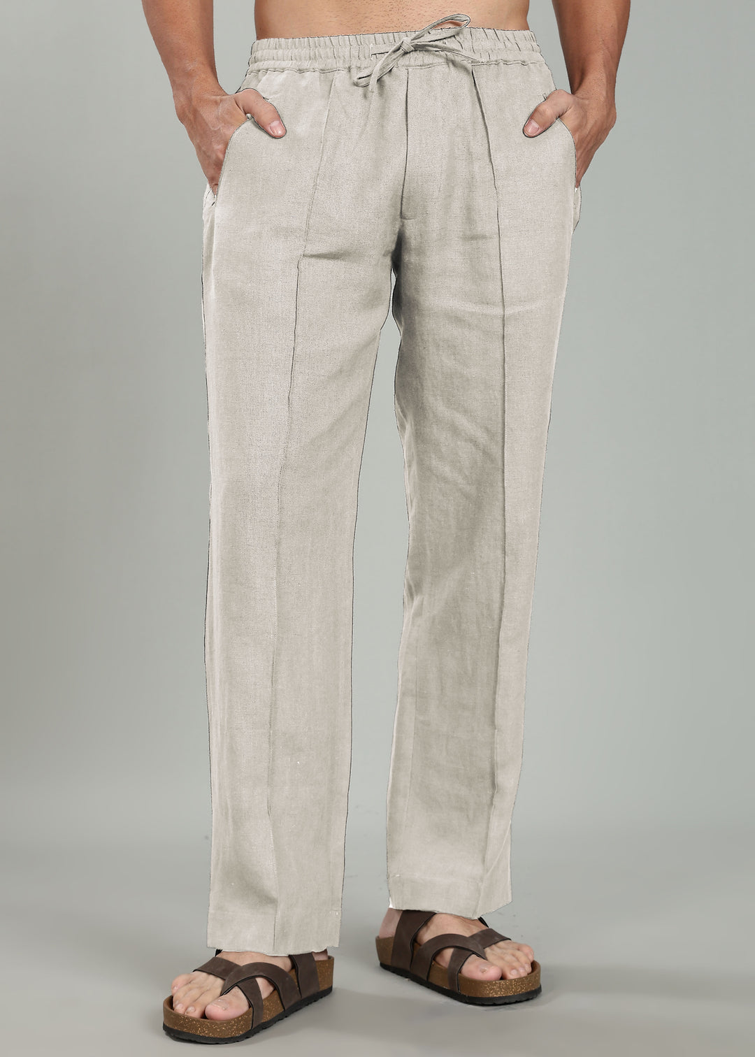 100% pure linen ecru pants worn by a person on a gray background