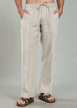 100% pure linen ecru pants worn by a person on a gray background