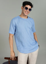 Man wearing 100% 60 LEA Olympic Blue Mandarin collar T - Shirt in an indoor grey background.