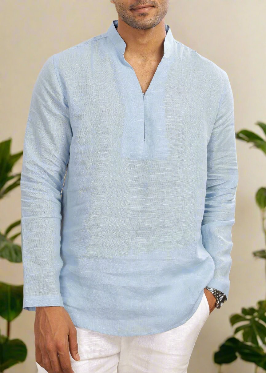 A man wearing a sky blue, full sleeve, broad-notch collar, pure linen short kurta.