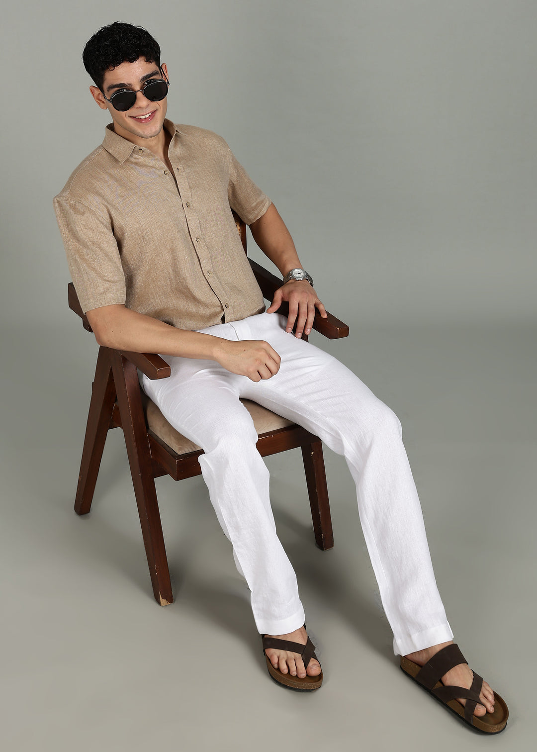 Man wearing 100% 60 LEA Mocha Half sleeve Shirt in an indoor grey background.