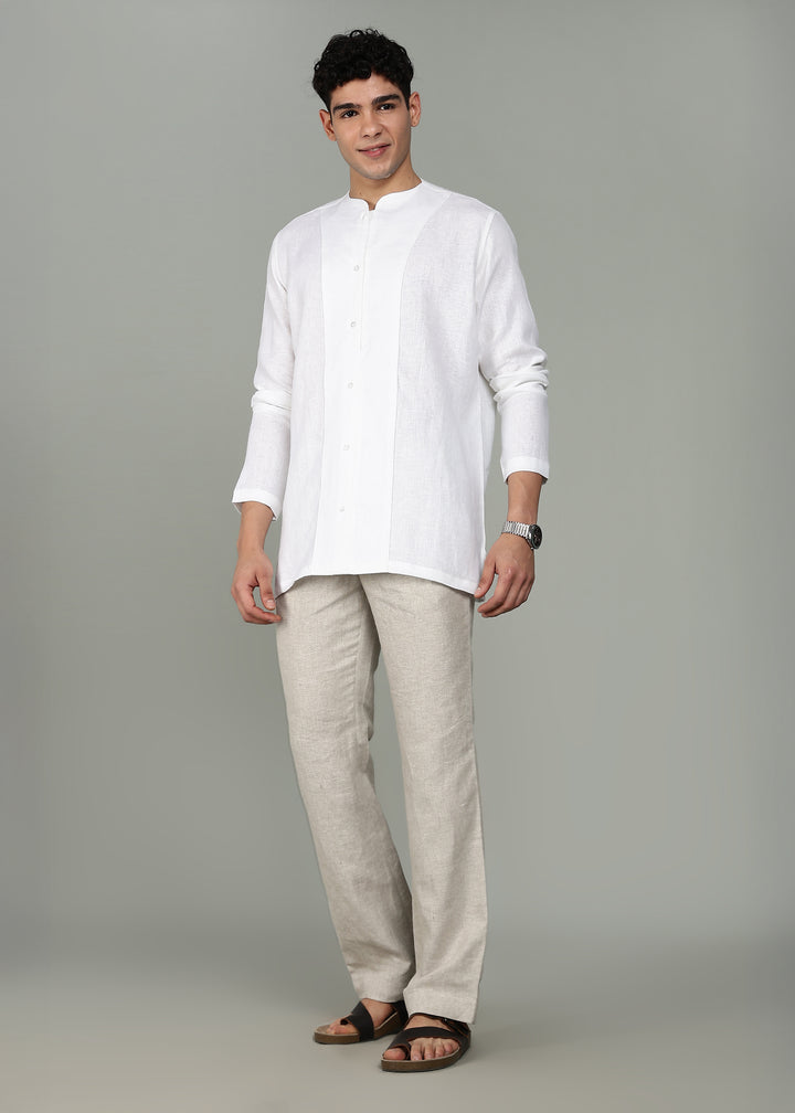 Man wearing a 100% pure linen white long-sleeve kurta in 44 LEA against a gray background