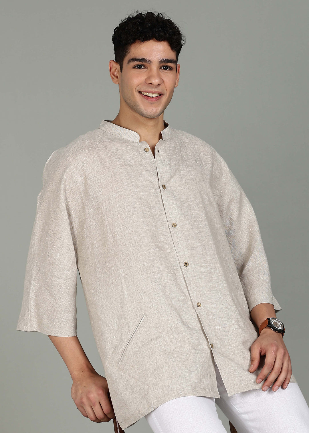 Man wearing a 100% pure linen ecru short kurta in 60 LEA with a gray background