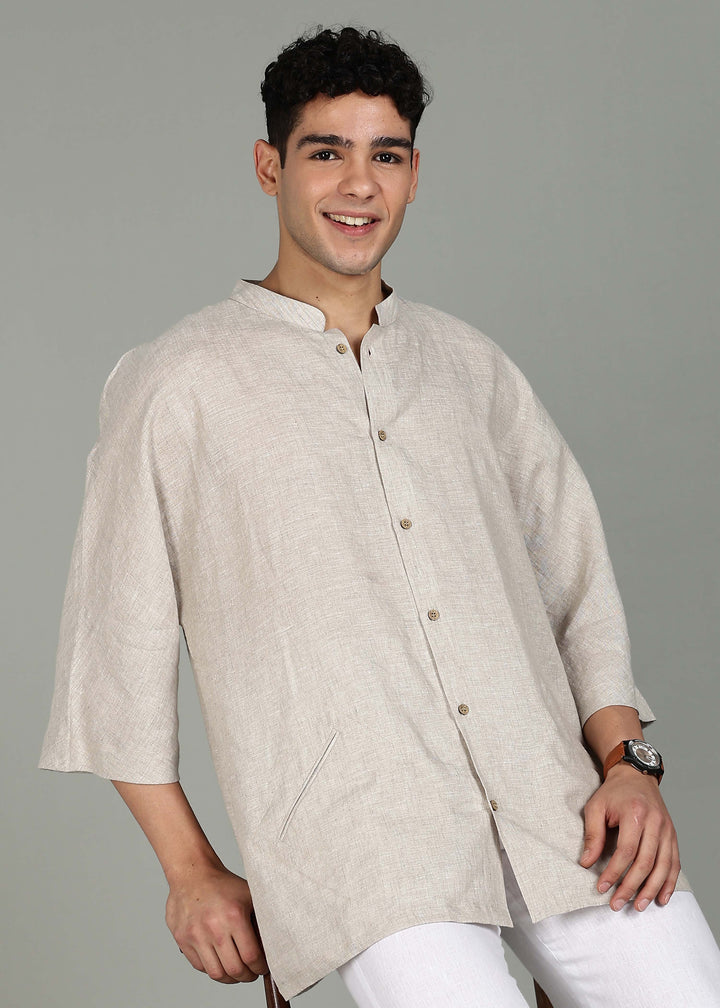 Man wearing a 100% pure linen ecru short kurta in 60 LEA with a gray background