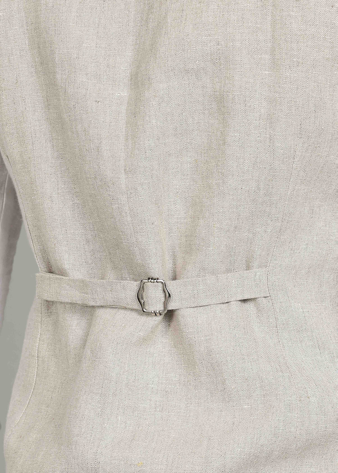 Man wearing a 100% pure linen ecru waistcoat in 25 LEA over a white shirt against a gray background