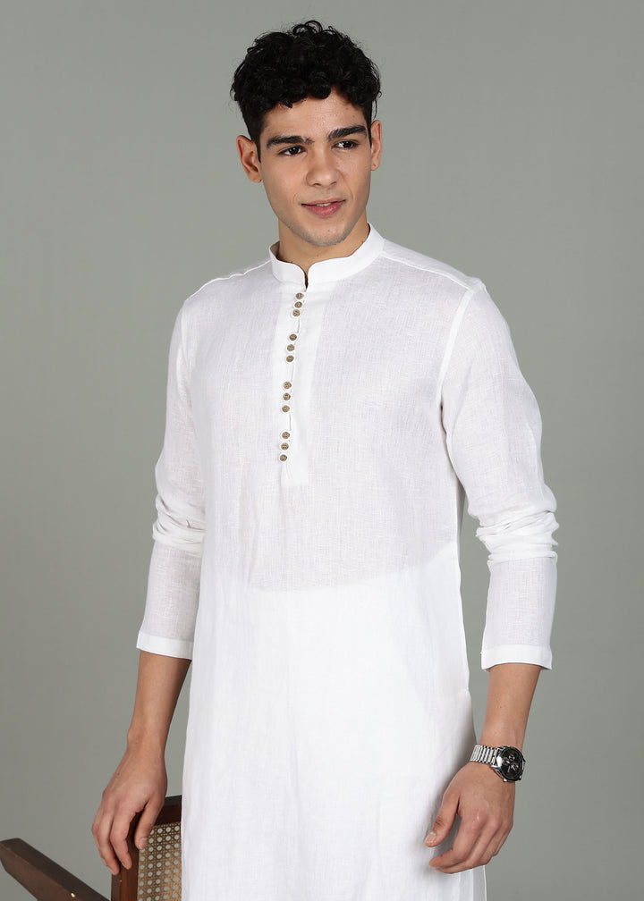 Man wearing a 100% pure linen white long kurta with pink floral design on the back in 44 LEA against a gray background