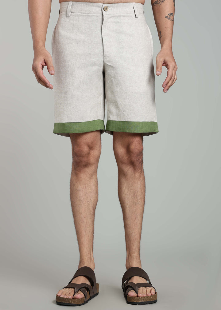 Man wearing 100% pure linen shorts in pure ecru with cossack-green accents in 25 LEA