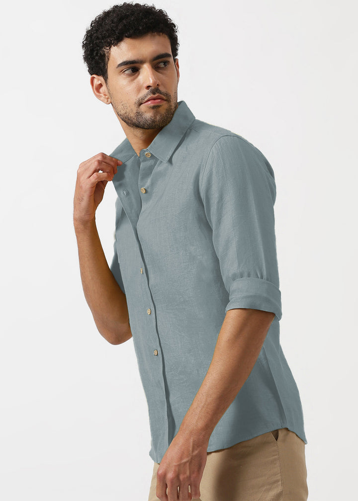Man wearing a 100% pure linen mineral grey shirt against a white background