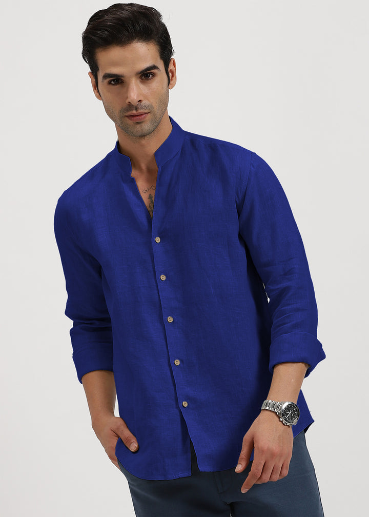 Man wearing a 100% pure linen egyptian blue shirt on a white background