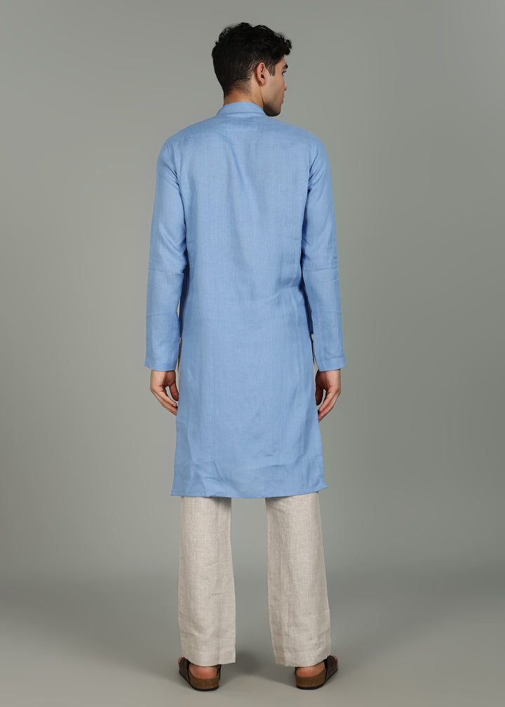 Man wearing a 100% pure linen olympic blue long kurta in 60 LEA with white detailing against a gray background