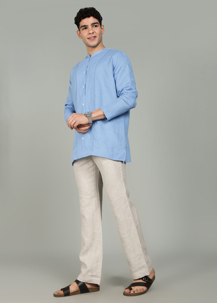 Man wearing a 100% pure linen olympic blue long-sleeve kurta in 60 LEA against a gray background