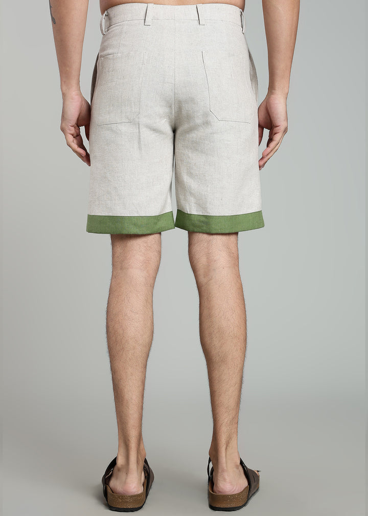 Man wearing 100% pure linen cuban-collar shirt and shorts in pure ecru with cossack-green accents in 60 LEA(shirt) & 25 LEA(shorts)