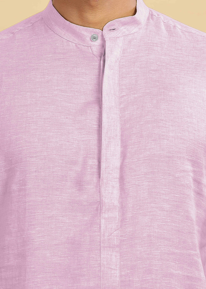 Close-up of a 100% pure linen hermosa pink kurta with a collar on a beige background