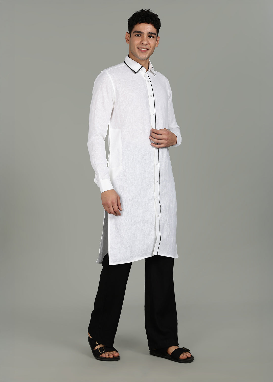 Man wearing a 100% pure linen white long kurta in 44 LEA with a gray background