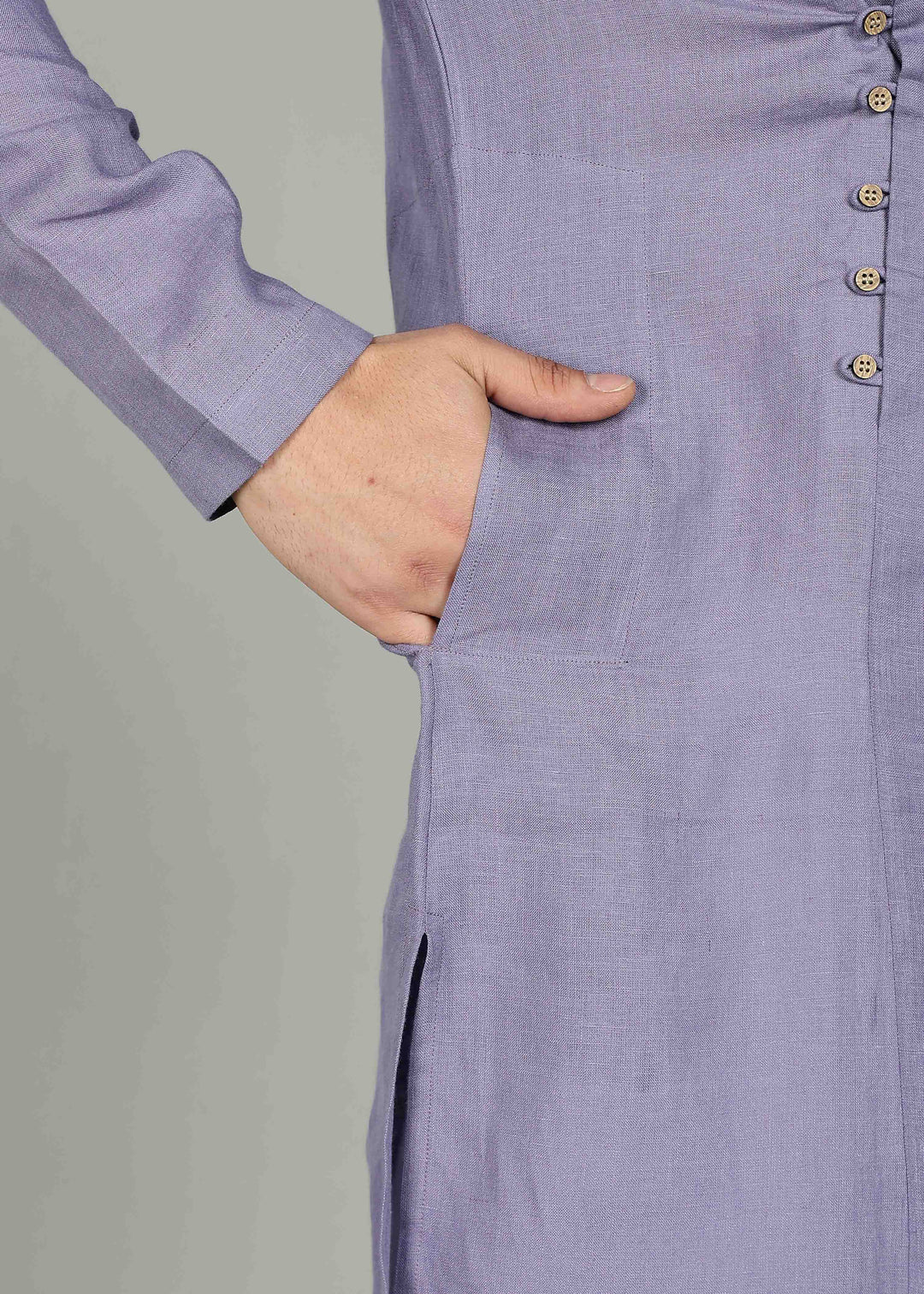 Man wearing a 100% Lavender violet 60 lea Kurta, with placket detail, in a Grey  Background indoor.