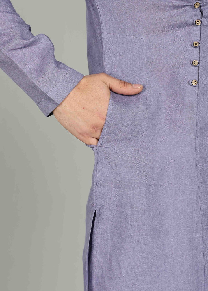 Man wearing a 100% Lavender violet 60 lea Kurta, with placket detail, in a Grey  Background indoor.