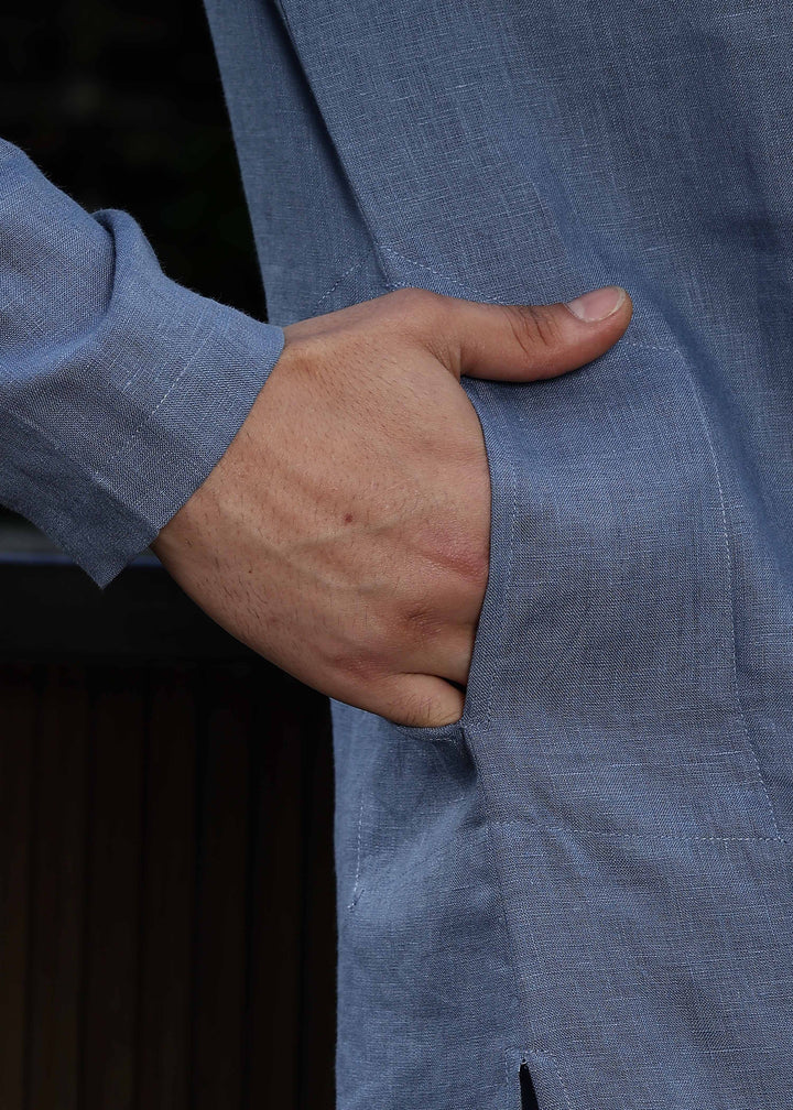 Man wearing Blue Grey Kurta, 100% pure linen, outdoor green background.