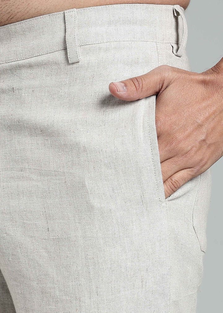 Man wearing 100% pure linen shorts in pure ecru with cossack-green accents in 25 LEA