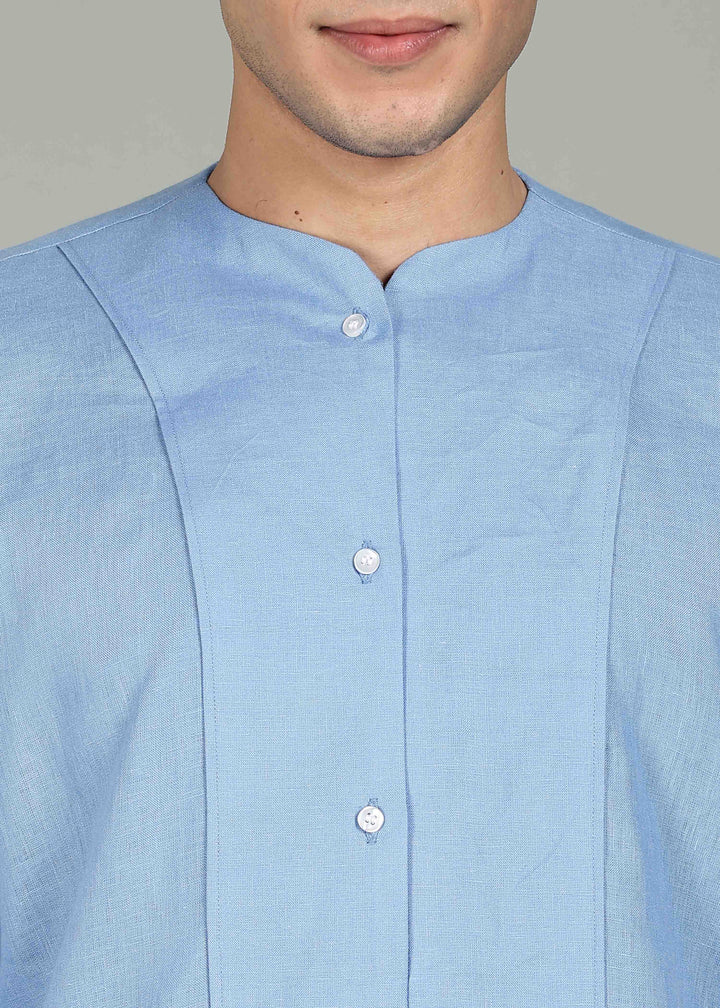 Man wearing a 100% pure linen olympic blue long-sleeve kurta in 60 LEA against a gray background
