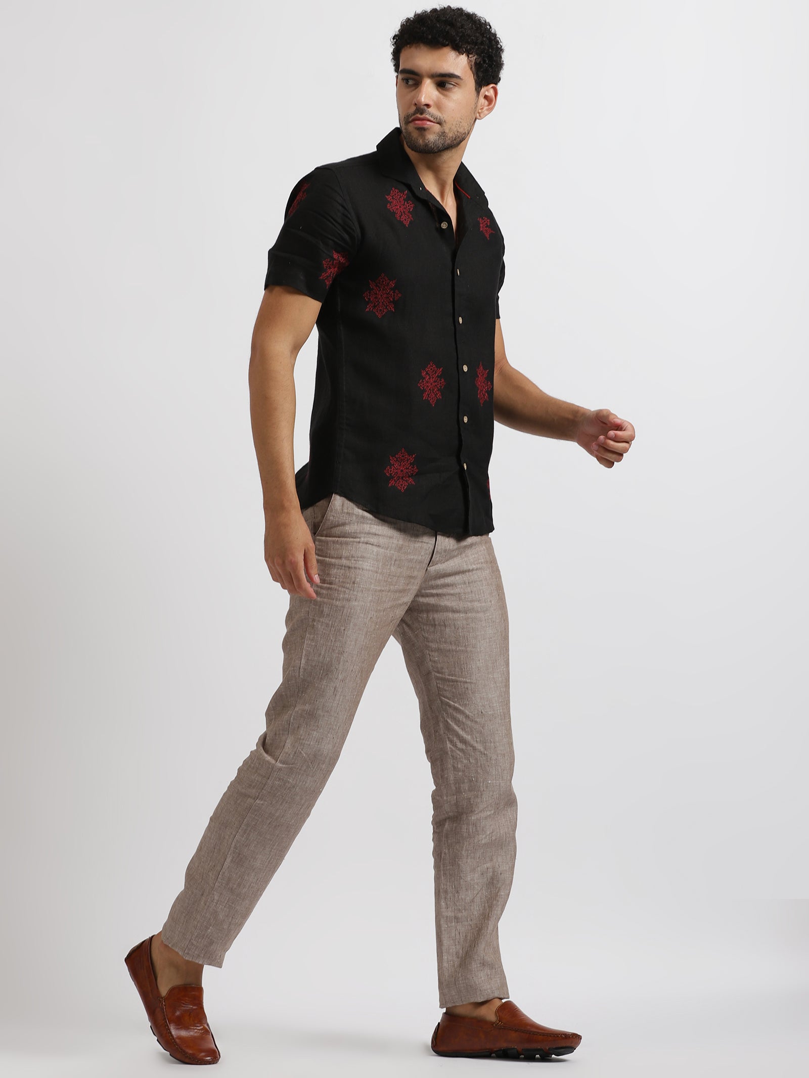 Fashion young man in black suit and red pants casual poses at studio  5971066 Stock Photo at Vecteezy