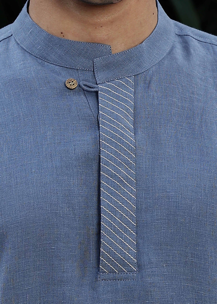 Man wearing Blue Grey Kurta, 100% pure linen, outdoor green background.