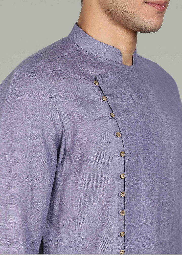 Man wearing a 100% Lavender violet 60 lea Kurta, with placket detail, in a Grey  Background indoor.