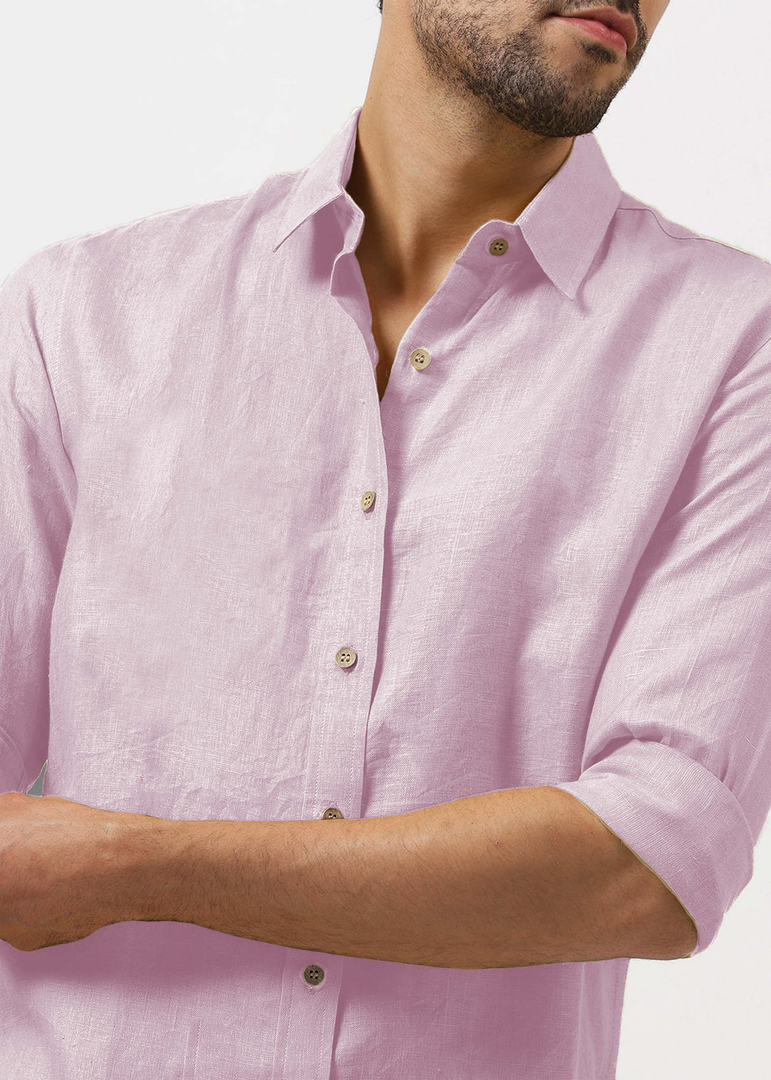 Man wearing a 100% pure linen hermosa pink shirt with rolled-up sleeves on a white background