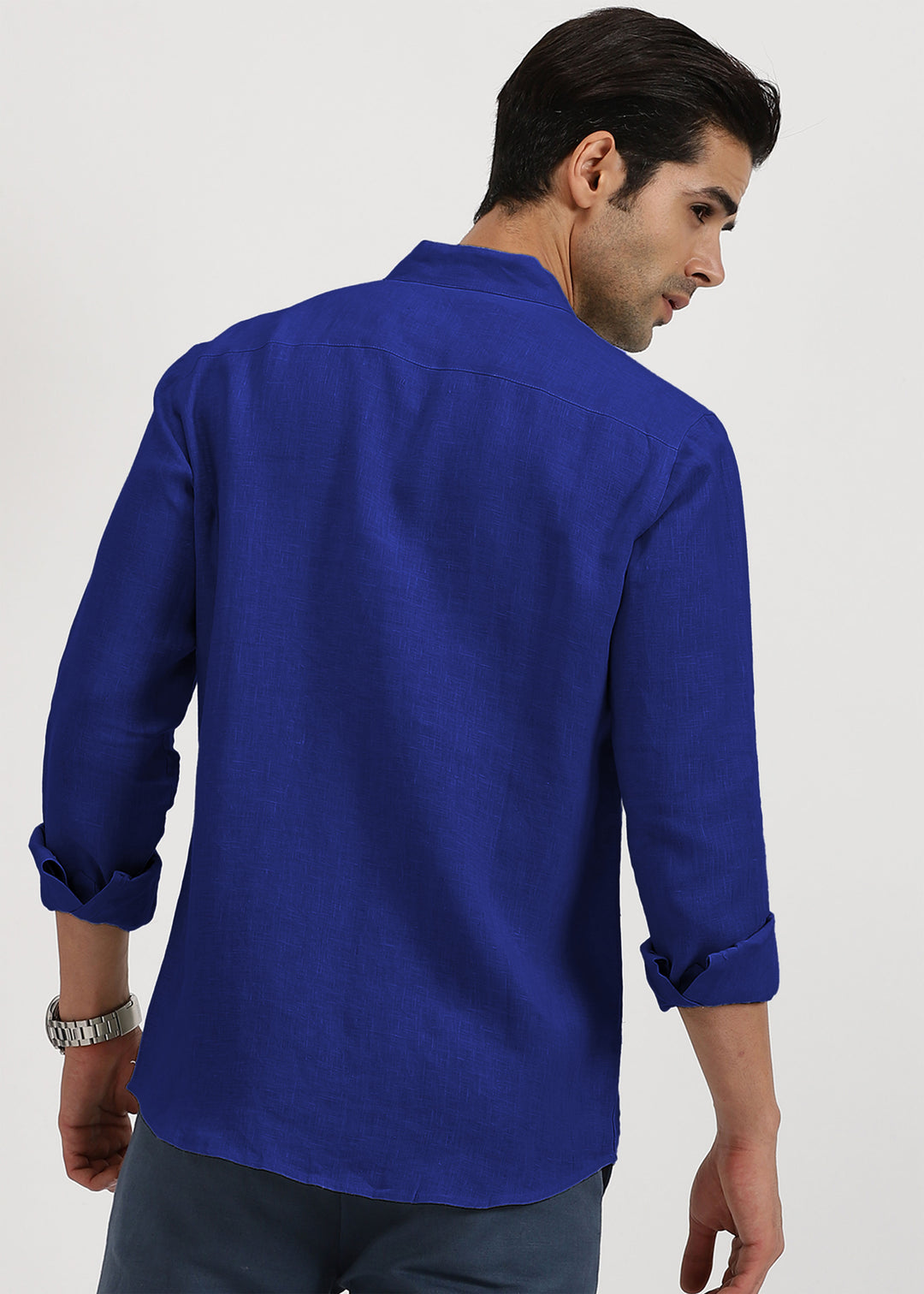 Man wearing a 100% pure linen egyptian blue shirt on a white background