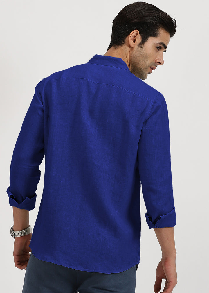 Man wearing a 100% pure linen egyptian blue shirt on a white background