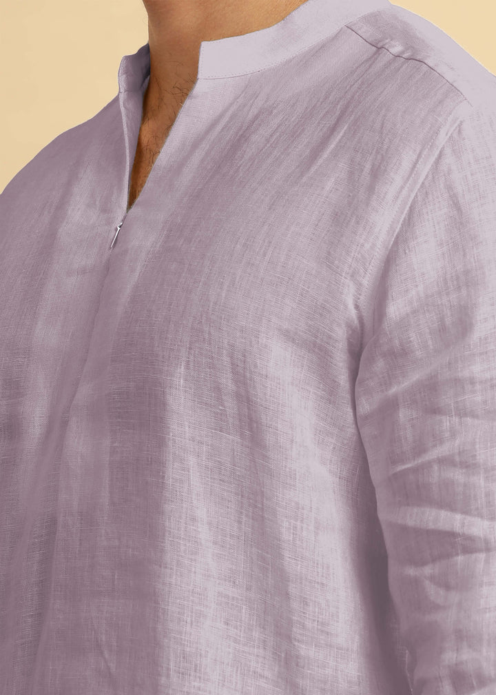 Close-up of a 100% pure linen cameo pink short kurta with a beige background