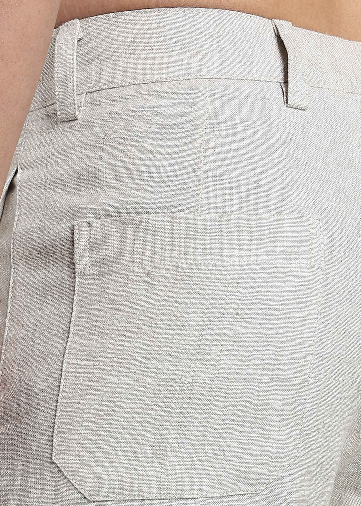 Man wearing 100% pure linen shorts in pure ecru with cossack-green accents in 25 LEA