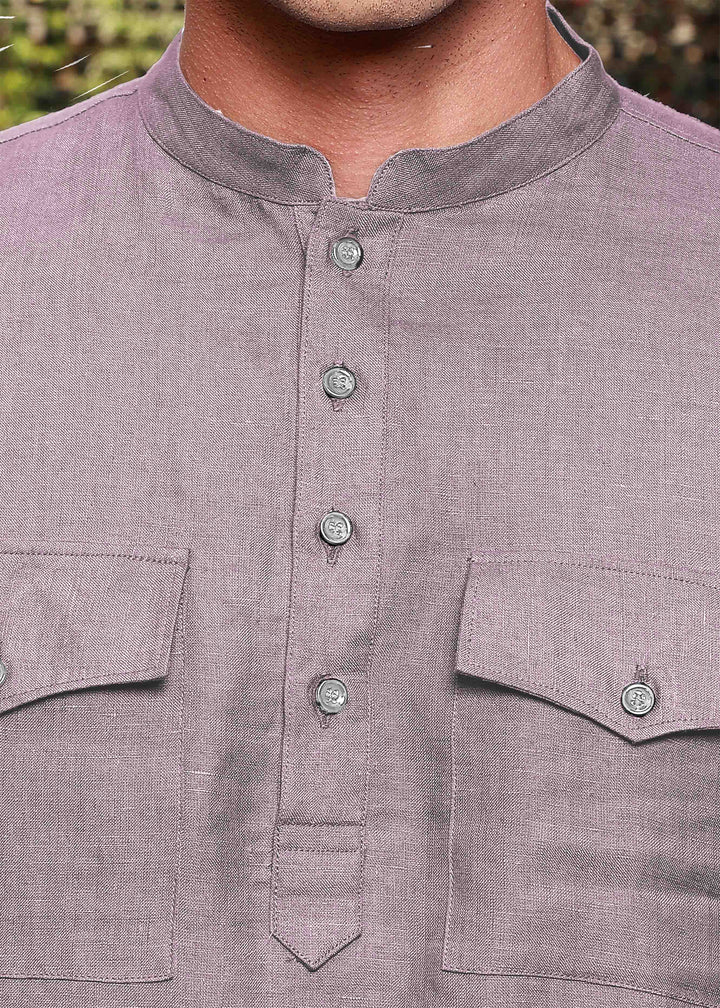 Close-up of a 100% pure linen cameo pink long kurta with button details and pocket design.