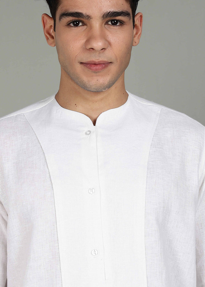 Man wearing a 100% pure linen white long-sleeve kurta in 44 LEA against a gray background