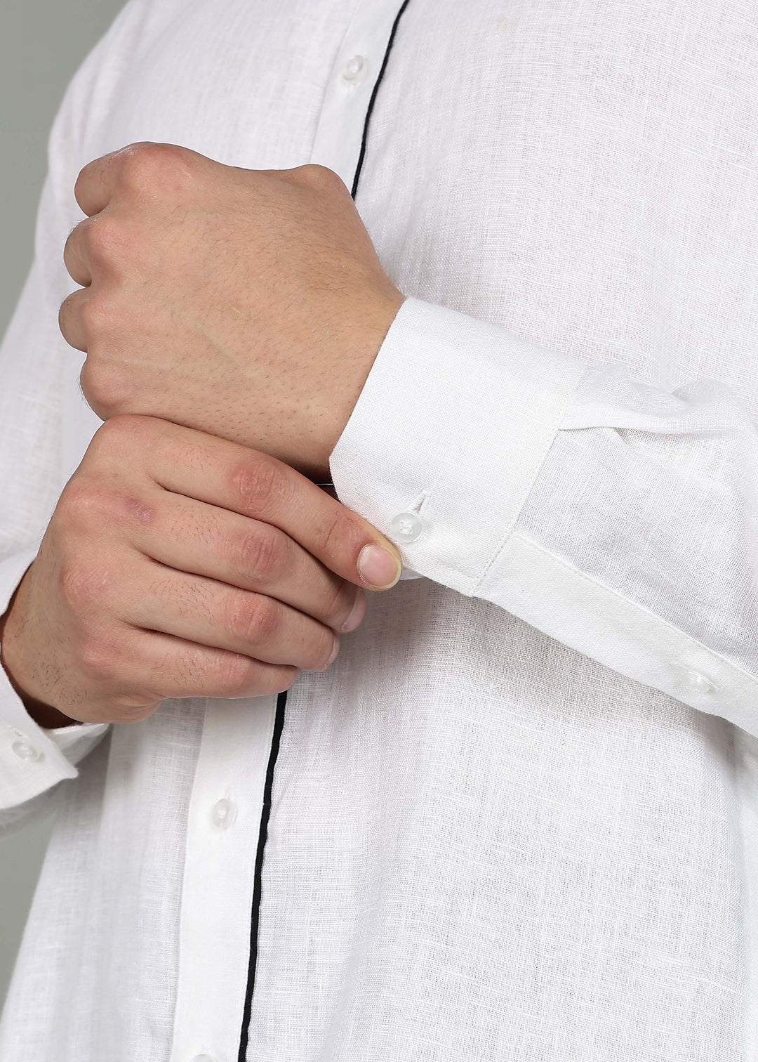 Man wearing a 100% pure linen white long kurta in 44 LEA with a gray background