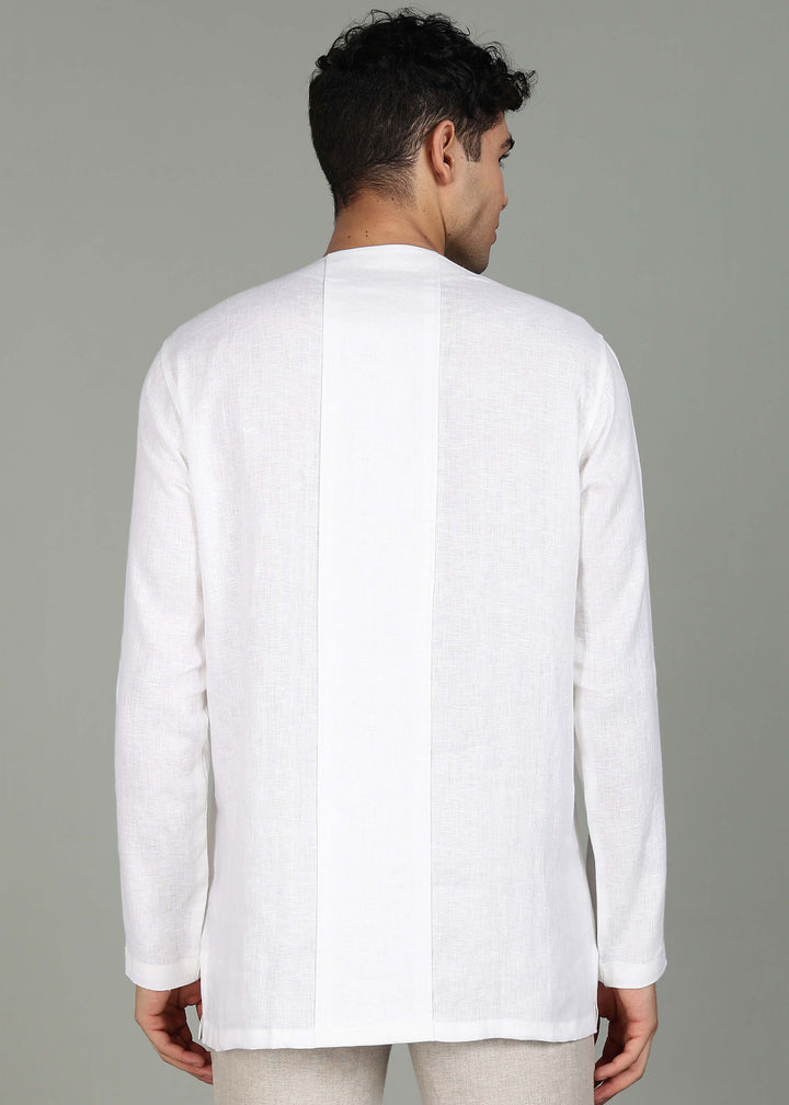 Man wearing a 100% pure linen white long-sleeve kurta in 44 LEA against a gray background