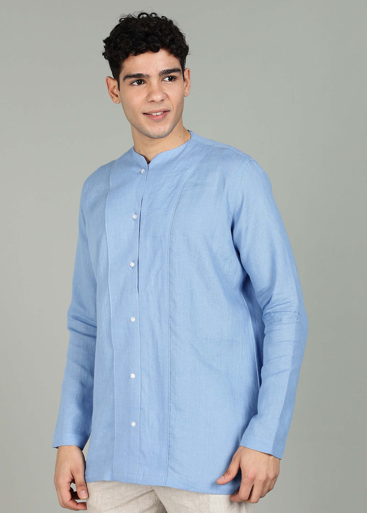Man wearing a 100% pure linen olympic blue long-sleeve kurta in 60 LEA against a gray background