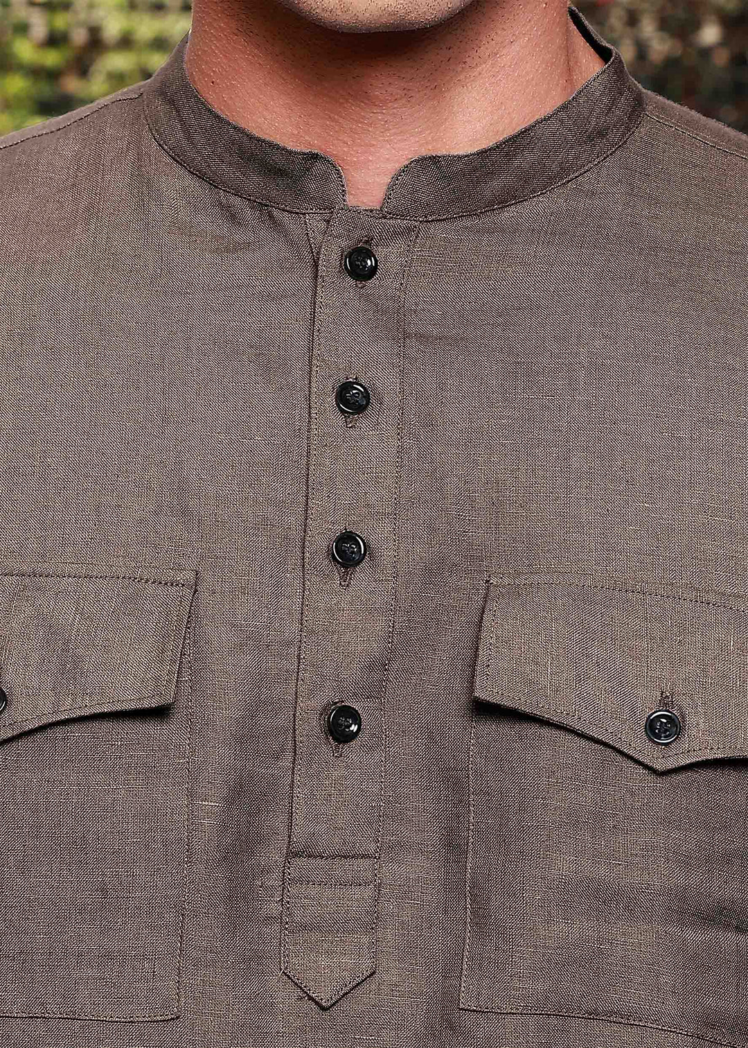 Close-up of a 100% pure linen fawn pink long kurta with button details and two pockets.