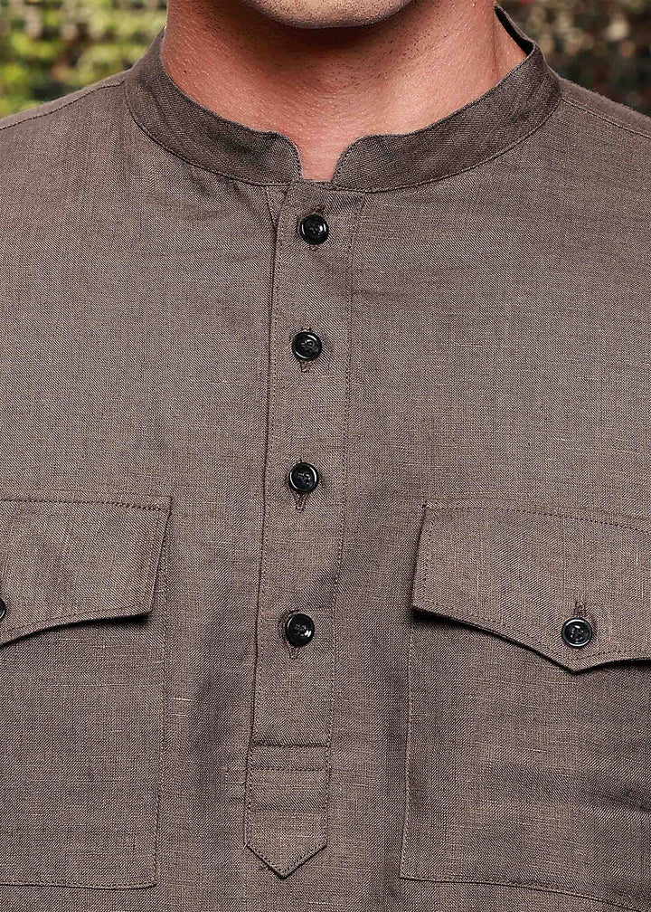 Close-up of a 100% pure linen fawn pink long kurta with button details and two pockets.