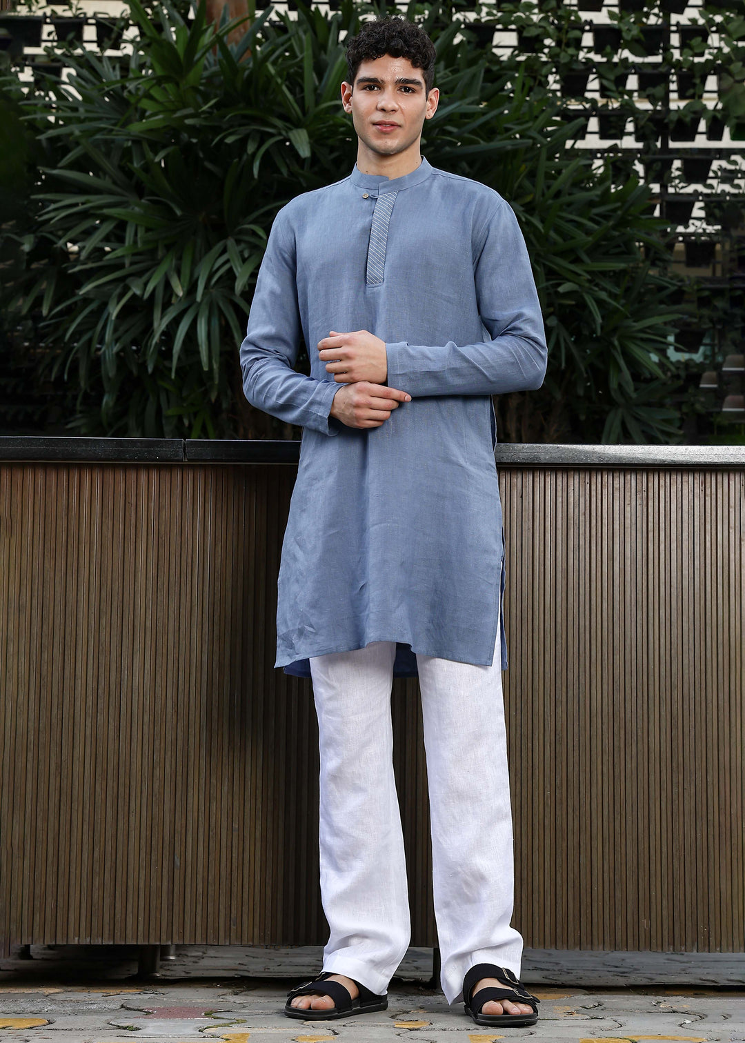 Man wearing Blue Grey Kurta, 100% pure linen, outdoor green background.
