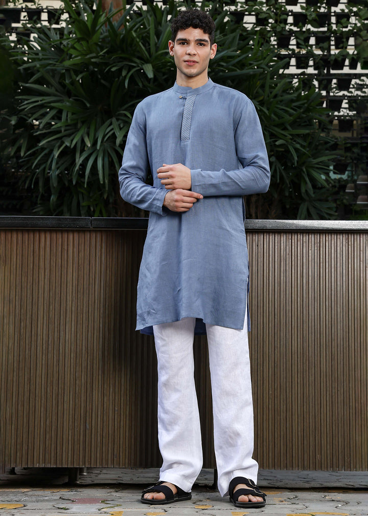 Man wearing Blue Grey Kurta, 100% pure linen, outdoor green background.