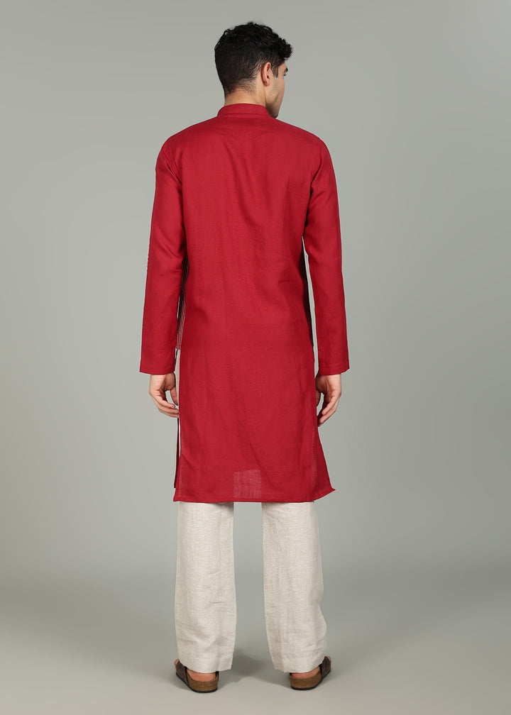 Man wearing a 100% pure linen mud red long kurta in 60 LEA with white detailing against a gray background