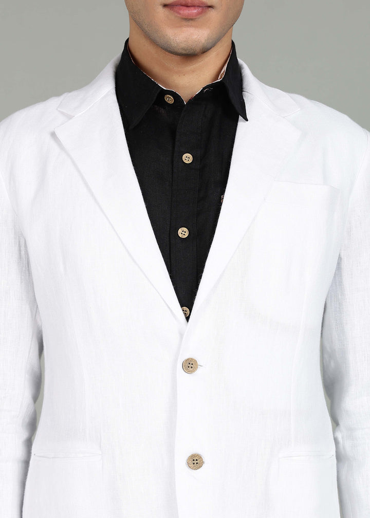 Man wearing a 100% pure linen white Jacket in 25 LEA over a black shirt on a gray background