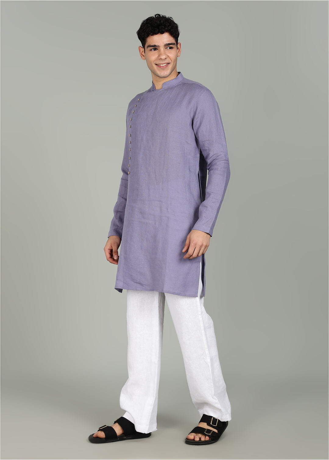 Man wearing a 100% Lavender violet 60 lea Kurta, with placket detail, in a Grey  Background indoor.