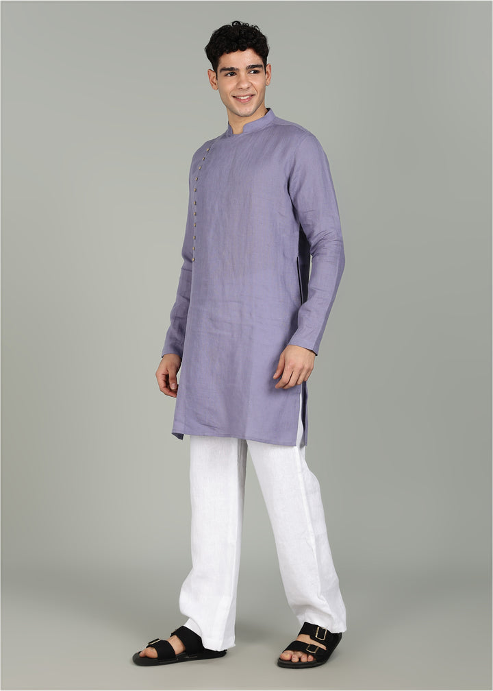 Man wearing a 100% Lavender violet 60 lea Kurta, with placket detail, in a Grey  Background indoor.