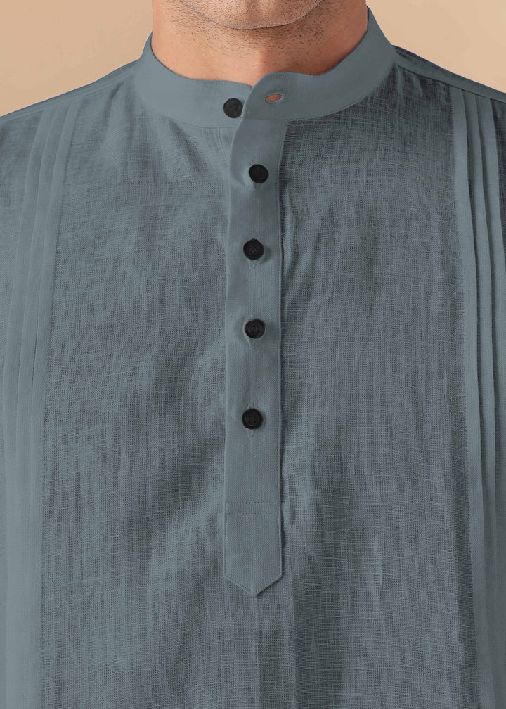 Close-up of a 100% pure linen mineral grey short kurta with black buttons on a beige background
