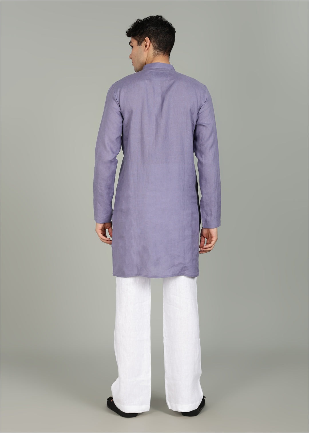 Man wearing a 100% Lavender violet 60 lea Kurta, with placket detail, in a Grey  Background indoor.