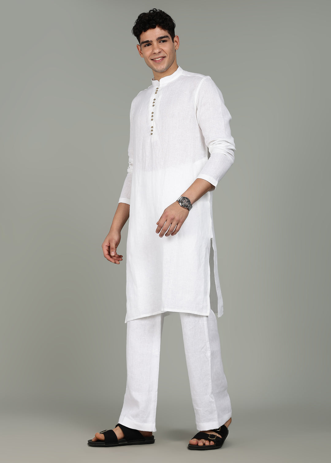 Man wearing a 100% pure linen white long kurta with pink floral design on the back in 44 LEA against a gray background