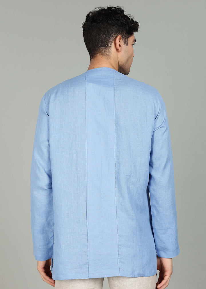 Man wearing a 100% pure linen olympic blue long-sleeve kurta in 60 LEA against a gray background