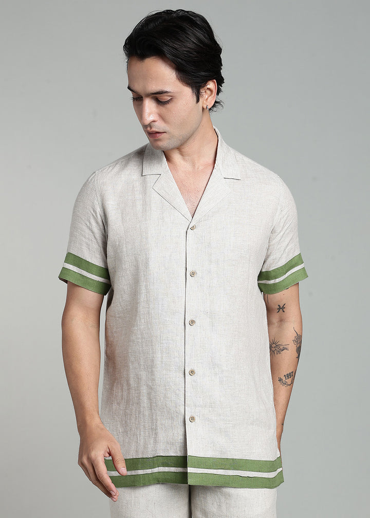 Man wearing 100% pure linen cuban-collar shirt and shorts in pure ecru with cossack-green accents in 60 LEA(shirt) & 25 LEA(shorts)
